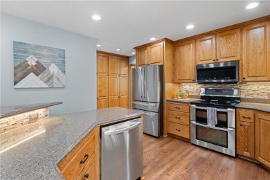 Welcome home to this stunning 5-bedroom, 4-bathroom residence - on Elk River Golf Club in Minnesota - for sale on GolfHomes.com, golf home, golf lot