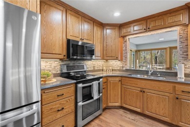 Welcome home to this stunning 5-bedroom, 4-bathroom residence - on Elk River Golf Club in Minnesota - for sale on GolfHomes.com, golf home, golf lot