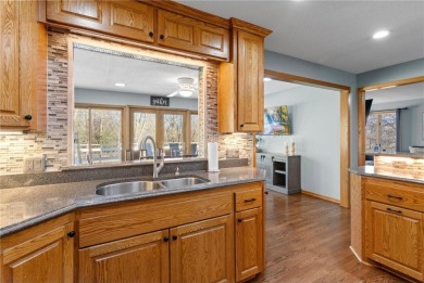 Welcome home to this stunning 5-bedroom, 4-bathroom residence - on Elk River Golf Club in Minnesota - for sale on GolfHomes.com, golf home, golf lot