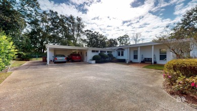 Welcome to this stunning Mid-Century home, a rare find in Yester on Spring Hill College Golf Course in Alabama - for sale on GolfHomes.com, golf home, golf lot