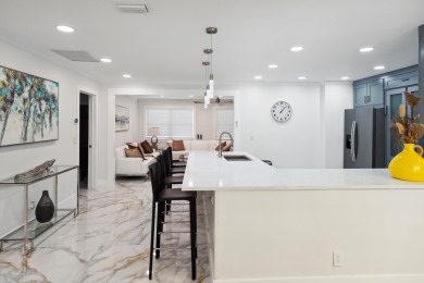 Spectacular fully renovated& fully furnished single-family home on BallenIsles Golf and Country Club in Florida - for sale on GolfHomes.com, golf home, golf lot