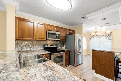 This great first floor end unit, with a large screened in back on Palmetto Greens Golf and Country Club in South Carolina - for sale on GolfHomes.com, golf home, golf lot