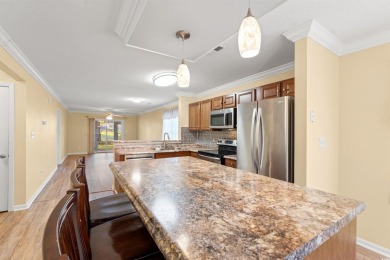 This great first floor end unit, with a large screened in back on Palmetto Greens Golf and Country Club in South Carolina - for sale on GolfHomes.com, golf home, golf lot