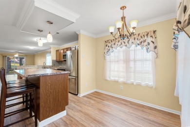This great first floor end unit, with a large screened in back on Palmetto Greens Golf and Country Club in South Carolina - for sale on GolfHomes.com, golf home, golf lot