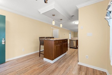 This great first floor end unit, with a large screened in back on Palmetto Greens Golf and Country Club in South Carolina - for sale on GolfHomes.com, golf home, golf lot