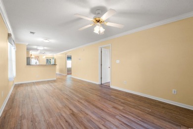 This great first floor end unit, with a large screened in back on Palmetto Greens Golf and Country Club in South Carolina - for sale on GolfHomes.com, golf home, golf lot