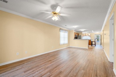 This great first floor end unit, with a large screened in back on Palmetto Greens Golf and Country Club in South Carolina - for sale on GolfHomes.com, golf home, golf lot