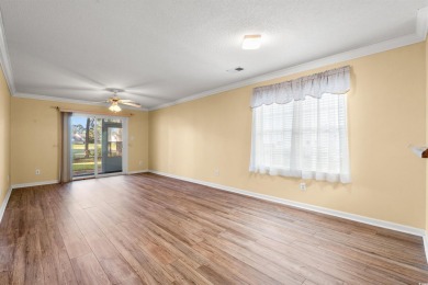 This great first floor end unit, with a large screened in back on Palmetto Greens Golf and Country Club in South Carolina - for sale on GolfHomes.com, golf home, golf lot