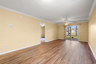 This great first floor end unit, with a large screened in back on Palmetto Greens Golf and Country Club in South Carolina - for sale on GolfHomes.com, golf home, golf lot