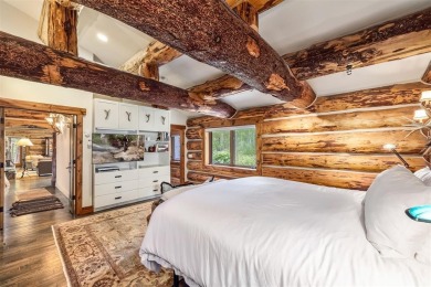 This secluded log home is a sanctuary from the world, with on The River Course At Keystone in Colorado - for sale on GolfHomes.com, golf home, golf lot