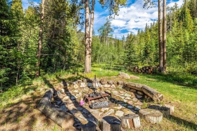 This secluded log home is a sanctuary from the world, with on The River Course At Keystone in Colorado - for sale on GolfHomes.com, golf home, golf lot