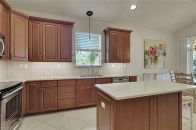 This well-cared for Coach Home features stainless steel on Quail West Golf and Country Club in Florida - for sale on GolfHomes.com, golf home, golf lot