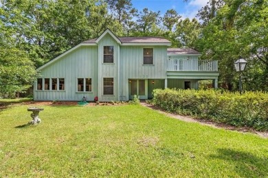 Stately Mid Century Modern 4-bedroom home situated on a wooded on Covington Country Club in Louisiana - for sale on GolfHomes.com, golf home, golf lot