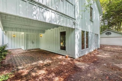 Stately Mid Century Modern 4-bedroom home situated on a wooded on Covington Country Club in Louisiana - for sale on GolfHomes.com, golf home, golf lot