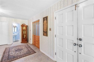 Stately Mid Century Modern 4-bedroom home situated on a wooded on Covington Country Club in Louisiana - for sale on GolfHomes.com, golf home, golf lot
