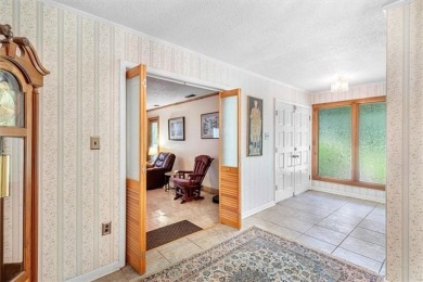 Stately Mid Century Modern 4-bedroom home situated on a wooded on Covington Country Club in Louisiana - for sale on GolfHomes.com, golf home, golf lot