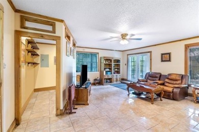 Stately Mid Century Modern 4-bedroom home situated on a wooded on Covington Country Club in Louisiana - for sale on GolfHomes.com, golf home, golf lot