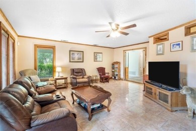 Stately Mid Century Modern 4-bedroom home situated on a wooded on Covington Country Club in Louisiana - for sale on GolfHomes.com, golf home, golf lot