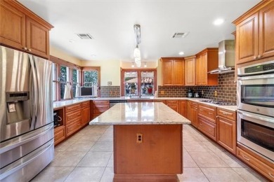 Stately Mid Century Modern 4-bedroom home situated on a wooded on Covington Country Club in Louisiana - for sale on GolfHomes.com, golf home, golf lot