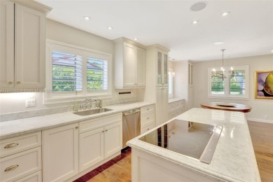 Set on an oversized 17,100-square-foot lot, nestled just around on Granada Golf Club in Florida - for sale on GolfHomes.com, golf home, golf lot
