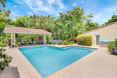 Set on an oversized 17,100-square-foot lot, nestled just around on Granada Golf Club in Florida - for sale on GolfHomes.com, golf home, golf lot