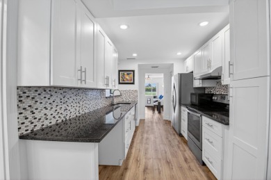 Delray's best kept secret! This beautiful and spacious condo is on Hamlet Country Club in Florida - for sale on GolfHomes.com, golf home, golf lot
