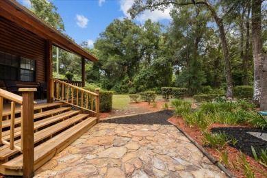 Custom Cypress Log Home Cabin located in the heart of Chiefland on Chiefland Golf and Country Club in Florida - for sale on GolfHomes.com, golf home, golf lot