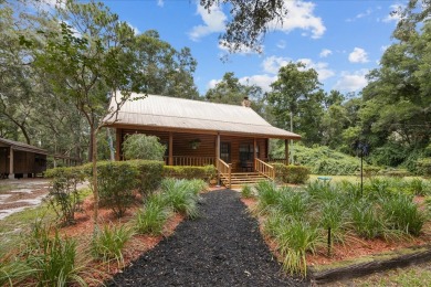 Custom Cypress Log Home Cabin located in the heart of Chiefland on Chiefland Golf and Country Club in Florida - for sale on GolfHomes.com, golf home, golf lot