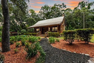 Custom Cypress Log Home Cabin located in the heart of Chiefland on Chiefland Golf and Country Club in Florida - for sale on GolfHomes.com, golf home, golf lot