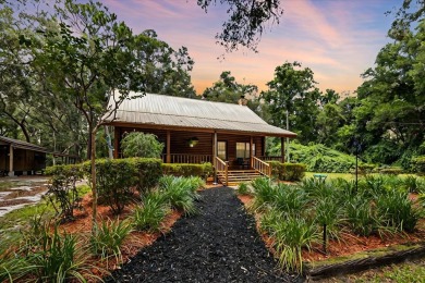 Custom Cypress Log Home Cabin located in the heart of Chiefland on Chiefland Golf and Country Club in Florida - for sale on GolfHomes.com, golf home, golf lot