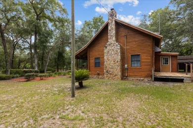 Custom Cypress Log Home Cabin located in the heart of Chiefland on Chiefland Golf and Country Club in Florida - for sale on GolfHomes.com, golf home, golf lot