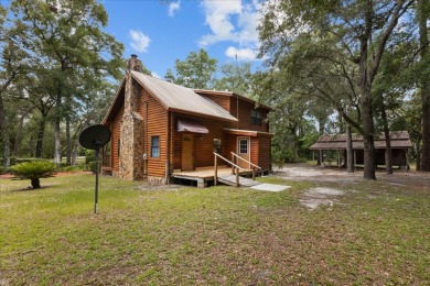 Custom Cypress Log Home Cabin located in the heart of Chiefland on Chiefland Golf and Country Club in Florida - for sale on GolfHomes.com, golf home, golf lot