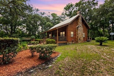 Custom Cypress Log Home Cabin located in the heart of Chiefland on Chiefland Golf and Country Club in Florida - for sale on GolfHomes.com, golf home, golf lot