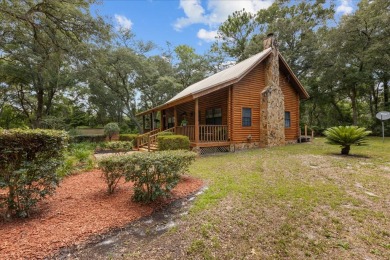 Custom Cypress Log Home Cabin located in the heart of Chiefland on Chiefland Golf and Country Club in Florida - for sale on GolfHomes.com, golf home, golf lot