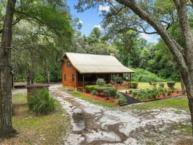 Custom Cypress Log Home Cabin located in the heart of Chiefland on Chiefland Golf and Country Club in Florida - for sale on GolfHomes.com, golf home, golf lot