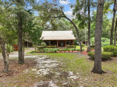 Custom Cypress Log Home Cabin located in the heart of Chiefland on Chiefland Golf and Country Club in Florida - for sale on GolfHomes.com, golf home, golf lot