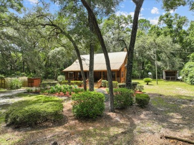 Custom Cypress Log Home Cabin located in the heart of Chiefland on Chiefland Golf and Country Club in Florida - for sale on GolfHomes.com, golf home, golf lot