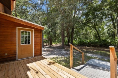 Custom Cypress Log Home Cabin located in the heart of Chiefland on Chiefland Golf and Country Club in Florida - for sale on GolfHomes.com, golf home, golf lot