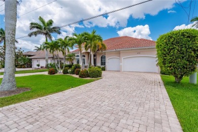 Experience exceptional waterfront living in this custom-built on Twin Isles Country Club in Florida - for sale on GolfHomes.com, golf home, golf lot