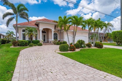 Experience exceptional waterfront living in this custom-built on Twin Isles Country Club in Florida - for sale on GolfHomes.com, golf home, golf lot