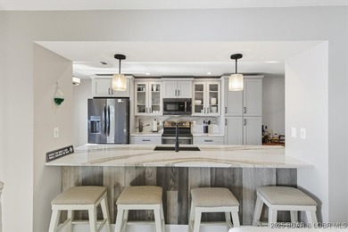 This truly spectacular Walk-in level Waterfront condo. Has on Seasons Ridge At Four Seasons in Missouri - for sale on GolfHomes.com, golf home, golf lot