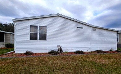 Located in a 55+ resort-style manufactured home community on on Big Cypress Golf and Country Club in Florida - for sale on GolfHomes.com, golf home, golf lot