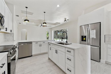Welcome to 13792 Long Lake, a fully remodeled luxury residence on Riverwood Golf Club in Florida - for sale on GolfHomes.com, golf home, golf lot