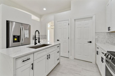 Welcome to 13792 Long Lake, a fully remodeled luxury residence on Riverwood Golf Club in Florida - for sale on GolfHomes.com, golf home, golf lot