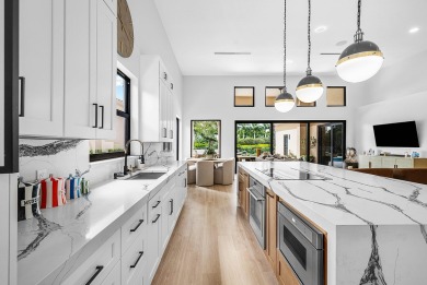 This stunning Restoration Hardware decorated home is located in on Broken Sound Golf and Club  in Florida - for sale on GolfHomes.com, golf home, golf lot
