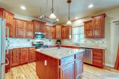 Beautiful custom built 5-bedroom, 4-bath two-story home tucked on Pelican Lakes Golf and Country Club in Colorado - for sale on GolfHomes.com, golf home, golf lot