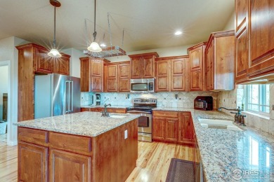 Beautiful custom built 5-bedroom, 4-bath two-story home tucked on Pelican Lakes Golf and Country Club in Colorado - for sale on GolfHomes.com, golf home, golf lot