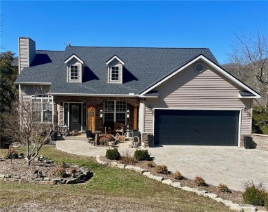 The cobblestone drive and walkway set the tone for this home's on Holiday Island Executive Golf Course in Arkansas - for sale on GolfHomes.com, golf home, golf lot