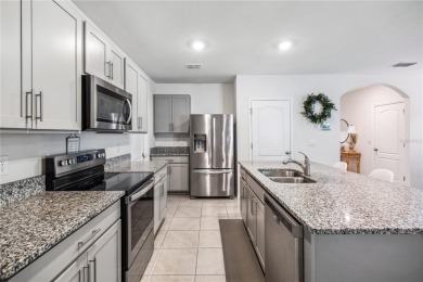 Welcome to this beautifully maintained 5-bedroom, 3-bathroom on Venetian Bay Golf Course in Florida - for sale on GolfHomes.com, golf home, golf lot