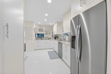 Welcome to this beautifully maintained and thoughtfully on Boca West Golf and Country Club in Florida - for sale on GolfHomes.com, golf home, golf lot